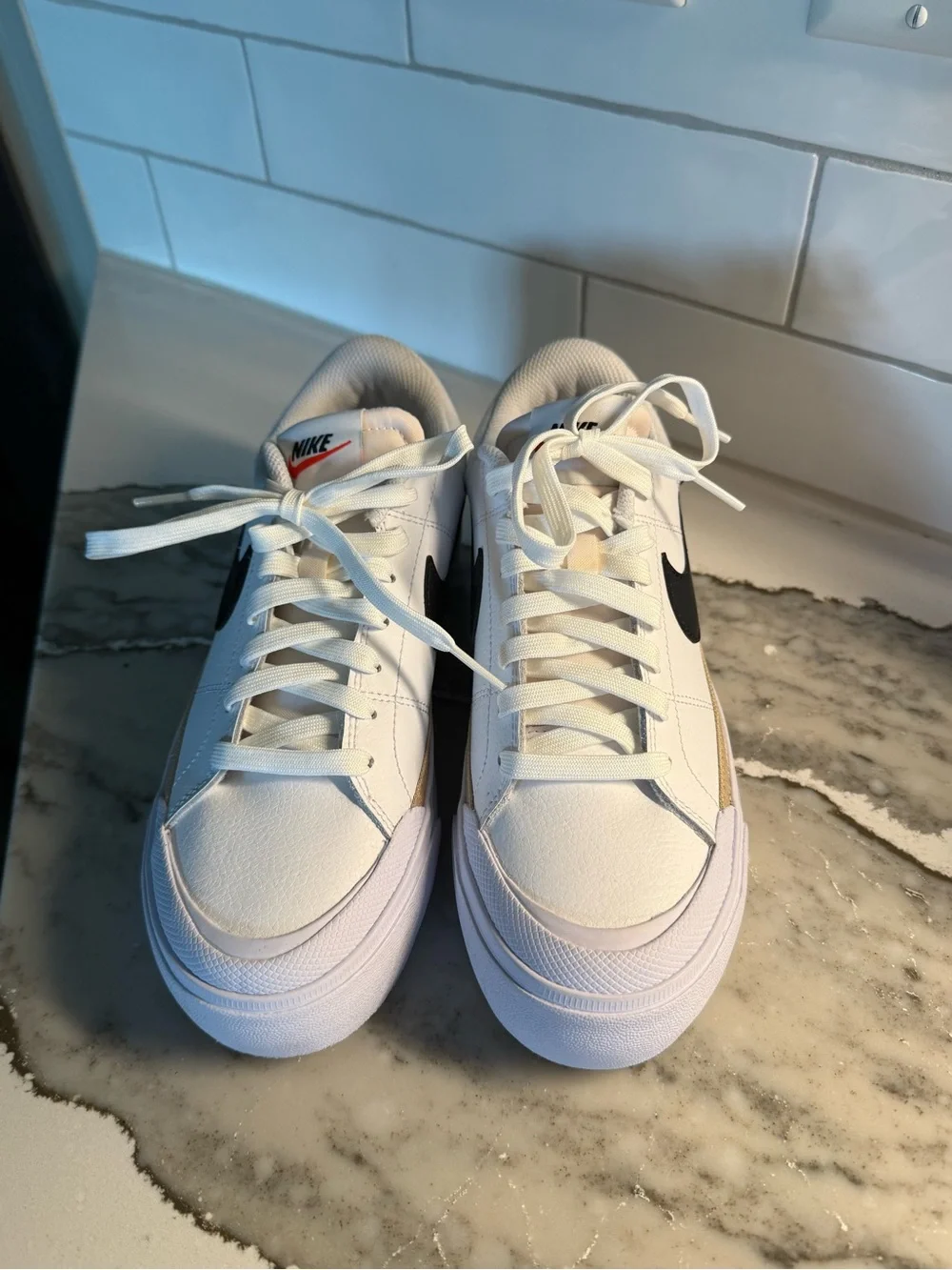 Nike Women’s White Sneakers with Black Swoosh and Tan Accent